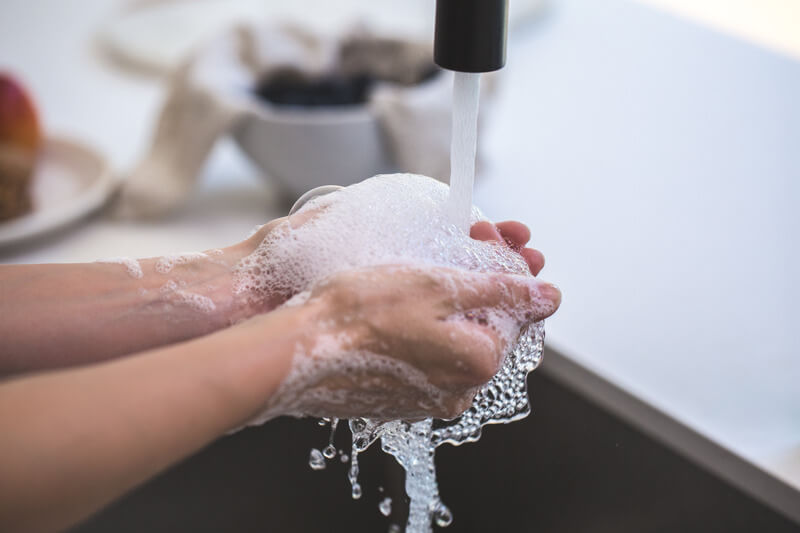 Washing hands to help prevent Coronavirus and keep workers safe