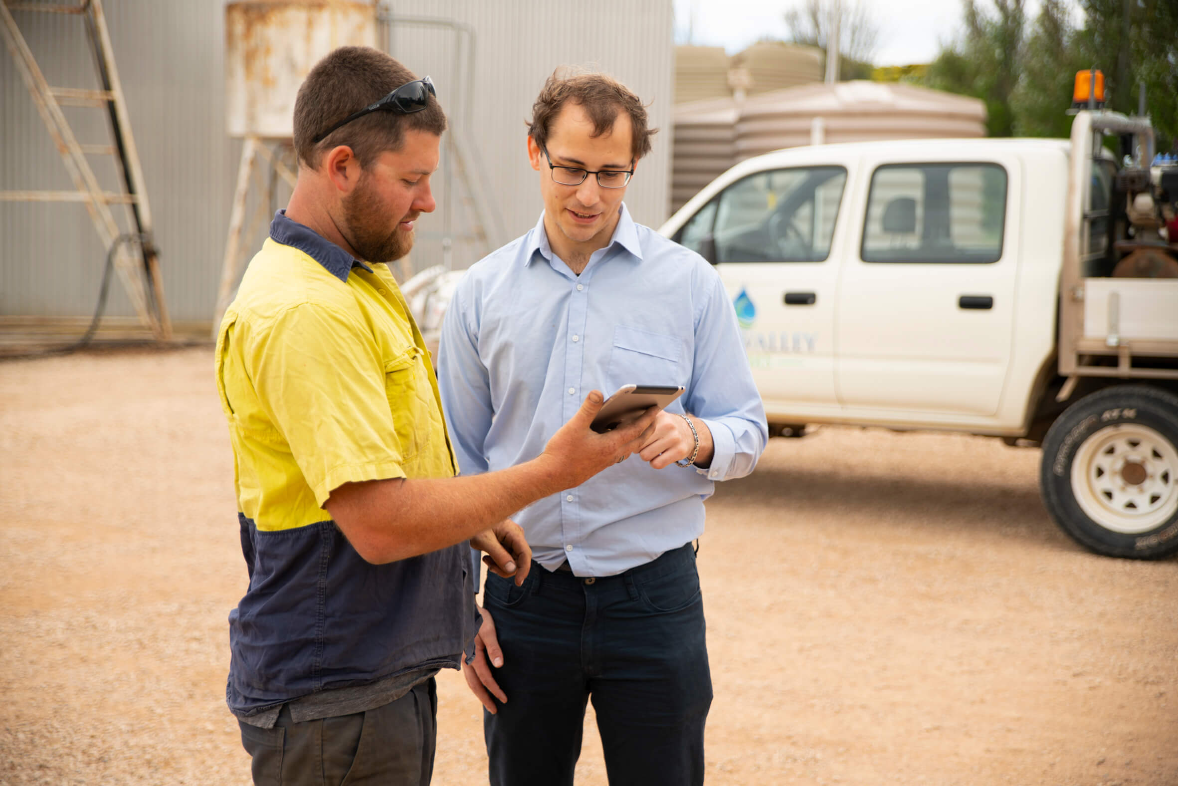 two workers with mobile phone